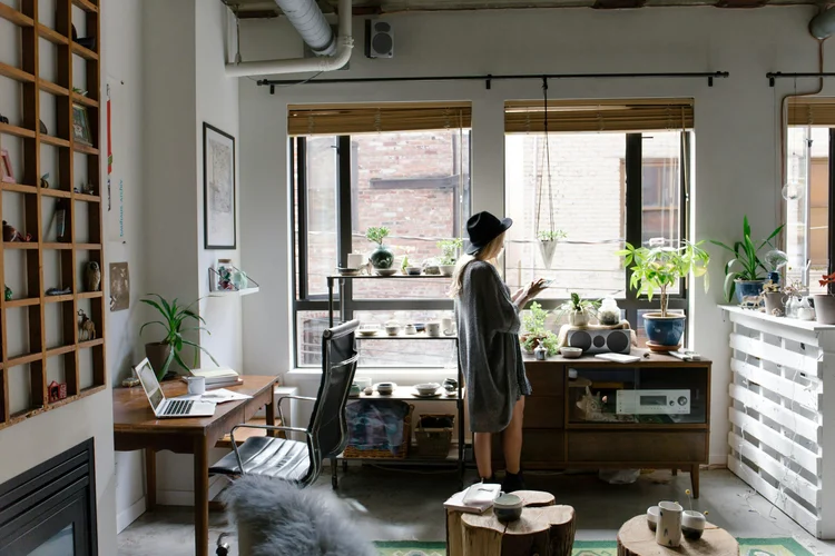 Woman working in a light-filled home office studio